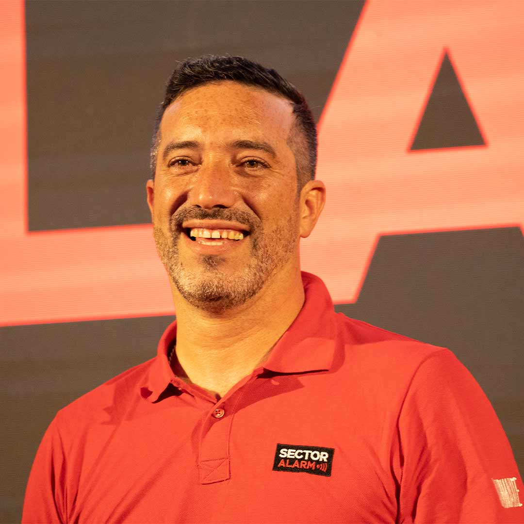 Worker from Sector Alarm smiling